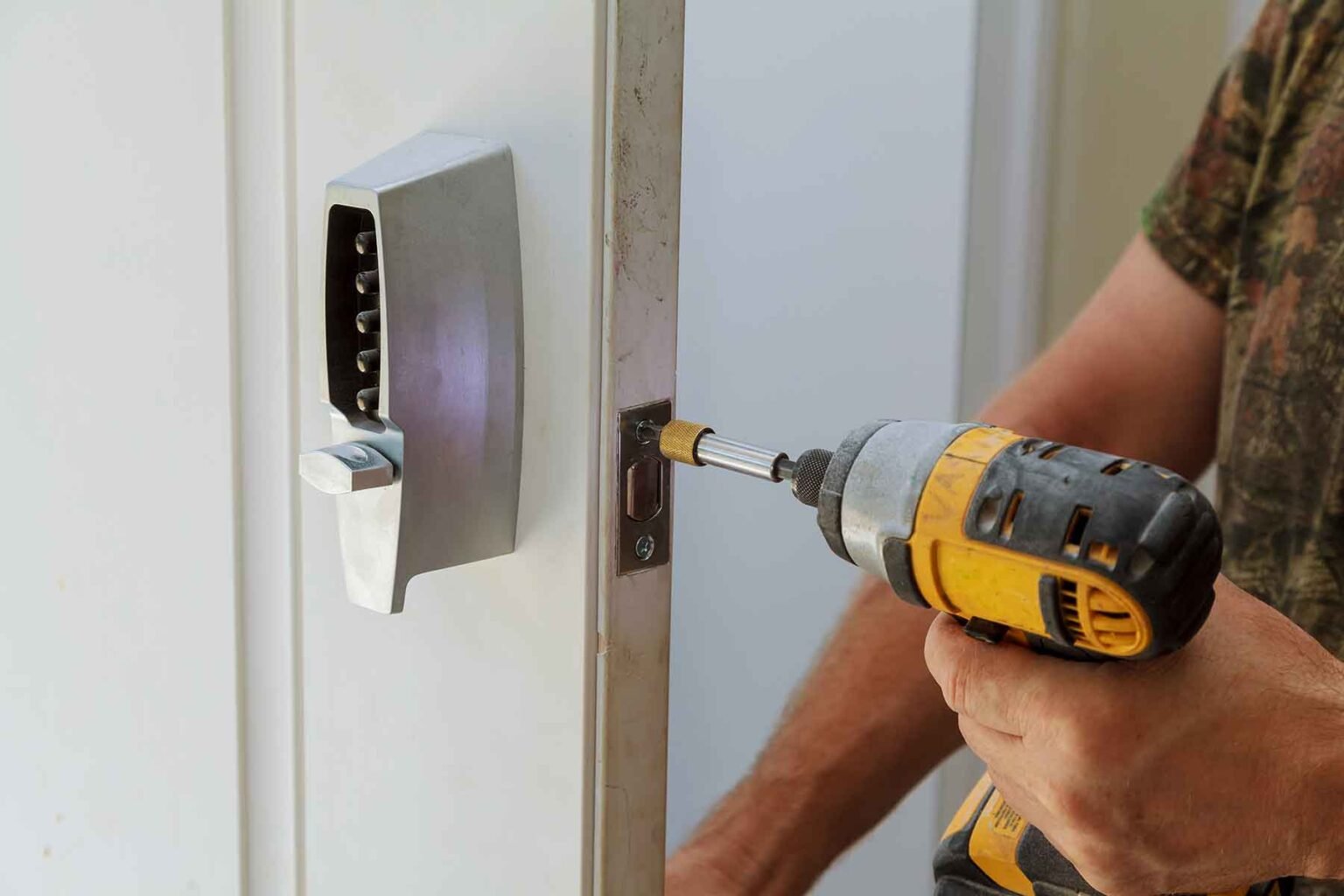 man-installing-of-the-door-with-lock-key-security-TVKNTEQ.jpg